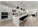 Spacious open concept kitchen with a large island, stainless appliances, and modern pendant lights at 1941 Quarry Park Nw Pl, Atlanta, GA 30318