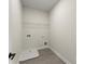 Functional laundry room featuring a utility sink and practical overhead shelving at 1941 Quarry Park Nw Pl, Atlanta, GA 30318