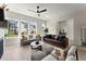 Open living room with fireplace, large windows, and modern furniture at 1941 Quarry Park Nw Pl, Atlanta, GA 30318