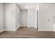 Bright, open living area with wood-look floors, white trim, and access to other areas of the home at 1941 Quarry Park Nw Pl, Atlanta, GA 30318