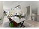 Bright, open living space with a modern dining area, staircase, and a cozy living room at 1941 Quarry Park Nw Pl, Atlanta, GA 30318