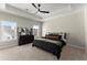 Relaxing main bedroom with a tray ceiling, fan, neutral carpet, and a dresser at 1941 Quarry Park Nw Pl, Atlanta, GA 30318
