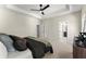 Spacious main bedroom with a tray ceiling, fan, ensuite, and neutral decor at 1941 Quarry Park Nw Pl, Atlanta, GA 30318
