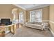 Bright living room featuring neutral carpet, large window, and open space for versatile furniture arrangement at 2040 Browning Bend Ct, Dacula, GA 30019