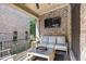 Outdoor balcony with brick surround, modern seating, and a view of the surrounding neighborhood at 8 Honour Nw Ave # 6, Atlanta, GA 30305