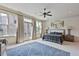 Bright bedroom with large windows, a ceiling fan, and access to a private balcony at 8 Honour Nw Ave # 6, Atlanta, GA 30305