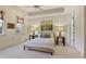 This bedroom features a neutral color palette, tray ceiling, and windows with stylish window treatments at 8 Honour Nw Ave # 6, Atlanta, GA 30305