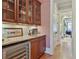 Butler's pantry featuring a beverage fridge, cabinetry, granite counters, and sink at 8 Honour Nw Ave # 6, Atlanta, GA 30305