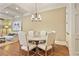 Elegant dining area with a round table, upholstered chairs, and hardwood floors at 8 Honour Nw Ave # 6, Atlanta, GA 30305