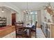 Dining room features a rustic wooden table, elegant lighting, and access to the outdoor patio at 8 Honour Nw Ave # 6, Atlanta, GA 30305