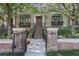 Charming brick townhome with a wrought iron fence and beautifully landscaped front yard at 8 Honour Nw Ave # 6, Atlanta, GA 30305