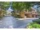 Gated townhome community featuring brick facades, manicured landscaping, and a secure entrance at 8 Honour Nw Ave # 6, Atlanta, GA 30305