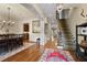 Welcoming foyer with a patterned stair runner, hardwood floors, and open view to adjacent rooms at 8 Honour Nw Ave # 6, Atlanta, GA 30305