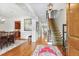 Inviting foyer with hardwood floors, elegant staircase, and view into dining and living areas at 8 Honour Nw Ave # 6, Atlanta, GA 30305