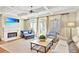 Bright living room featuring a fireplace, coffered ceilings, and large windows for natural light at 8 Honour Nw Ave # 6, Atlanta, GA 30305