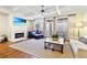 Cozy living room with fireplace, large windows, and comfortable seating at 8 Honour Nw Ave # 6, Atlanta, GA 30305