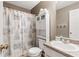 Cozy bathroom with seashell shower curtain, vanity and toilet, perfect for the holidays at 152 Country Cottage Cir, Carrollton, GA 30116
