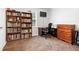 Comfortable bedroom featuring wood bookcases, neutral walls and carpet, and lots of natural light at 152 Country Cottage Cir, Carrollton, GA 30116