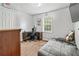 Bright bedroom with plush carpet, a comfortable bed, and a modern workspace at 152 Country Cottage Cir, Carrollton, GA 30116