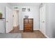 Comfortable bedroom featuring soft carpet, a wooden dresser and plenty of natural light at 152 Country Cottage Cir, Carrollton, GA 30116