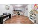 A bedroom features hardwood floors, a hanging chair and a custom built-in bed and storage solution at 152 Country Cottage Cir, Carrollton, GA 30116