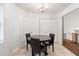 Dining room with tile floor and black dining set at 152 Country Cottage Cir, Carrollton, GA 30116