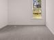 Neutral bedroom with carpet and a large window providing natural light at 1858 Lacebark Elm Way, Lawrenceville, GA 30045