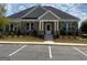The community clubhouse has a stone facade, covered porch and convenient parking at 1858 Lacebark Elm Way, Lawrenceville, GA 30045