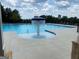 The community pool includes a central fountain feature and ample lounge seating at 1858 Lacebark Elm Way, Lawrenceville, GA 30045