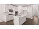 Gourmet kitchen with a large island, stainless appliances, and ample counter space at 1858 Lacebark Elm Way, Lawrenceville, GA 30045