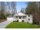 Charming two-story home with covered front porch and manicured lawn boasts excellent curb appeal at 348 Lakemoore Ne Dr, Atlanta, GA 30342