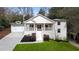 Charming renovated home with a welcoming front porch and well-maintained yard at 348 Lakemoore Ne Dr, Atlanta, GA 30342