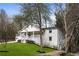 Charming two-story home with covered front porch and manicured lawn boasts classic curb appeal at 348 Lakemoore Ne Dr, Atlanta, GA 30342