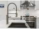 Close up of stainless steel sink with spring faucet and range oven at 348 Lakemoore Ne Dr, Atlanta, GA 30342