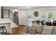 Cozy living room area with wooden floor, a staircase and a view out to the front yard at 348 Lakemoore Ne Dr, Atlanta, GA 30342