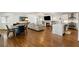 Spacious open-concept living area with a fireplace, kitchen, and dining space at 348 Lakemoore Ne Dr, Atlanta, GA 30342