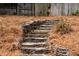 Stone stairs with landscape lighting adds elegant access to the upper and lower backyard areas at 348 Lakemoore Ne Dr, Atlanta, GA 30342