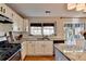 Bright kitchen featuring an island, stainless steel appliances, and hardwood floors at 2389 Lake Villas Ln, Duluth, GA 30097