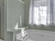 Large bathtub with natural light and a separate shower at 2452 Lakebrooke Dr, Marietta, GA 30066