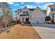 Charming two story home features red shutters, a two car garage and mature landscaping at 2452 Lakebrooke Dr, Marietta, GA 30066