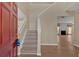 Inviting foyer with a staircase and view into the adjacent living room with fireplace at 2452 Lakebrooke Dr, Marietta, GA 30066
