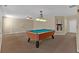 Spacious game room featuring a stylish pool table and neutral carpeting at 2452 Lakebrooke Dr, Marietta, GA 30066