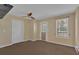 Inviting living area with neutral paint, carpet, ceiling fan, and natural light at 2452 Lakebrooke Dr, Marietta, GA 30066