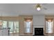 Open living room with a ceiling fan and fireplace, perfect for relaxation and entertaining at 2452 Lakebrooke Dr, Marietta, GA 30066