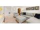 Spacious basement area with a comfortable seating area, ottoman, and shelving at 5417 Flat Rock Pt, Stonecrest, GA 30038