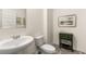 Bathroom featuring a pedestal sink, toilet, and decorative accents at 5417 Flat Rock Pt, Stonecrest, GA 30038