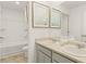 Bright bathroom featuring double sinks, a clean aesthetic, and modern fixtures at 5417 Flat Rock Pt, Stonecrest, GA 30038