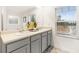 Bathroom featuring double sinks, light countertops, gray cabinets, and a large mirror at 5417 Flat Rock Pt, Stonecrest, GA 30038