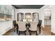 Stylish dining area features large mirrors, a dark ceiling, and bright lighting at 5417 Flat Rock Pt, Stonecrest, GA 30038