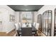 Dining room with a black ceiling, a large window, and views of the outdoors at 5417 Flat Rock Pt, Stonecrest, GA 30038